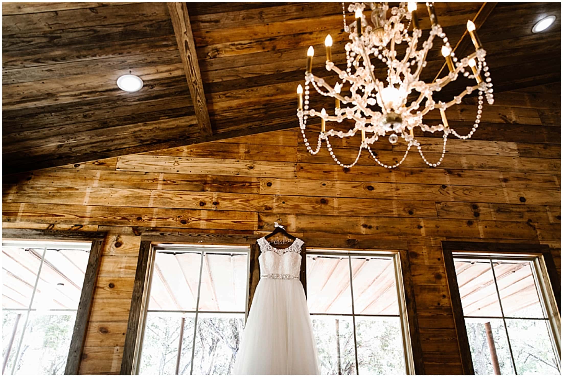 country wedding dress hanging from wall, Brit Nicole Photography, West Texas Barn Wedding, West Texas Small Wedding, West Texas wedding venue, DJ Platinum, Vera Wang engagement ring, Zales Manly Bands wedding ring, David's Bridal wedding dress, Krazy Cakes brides wedding cake, wedding cupcake, Betsey Johnson wedding high heels, Joy's Downtown Flowers wedding decor, Sparrow Creek Ranch, texas wedding ranch, places to get married in Texas, small intimate wedding, summer wedding, texas sky, bride and groom first look, first look with dad, matching bridesmaids robes, June wedding, junebug weddings, wandering weddings, the knot, best weddings