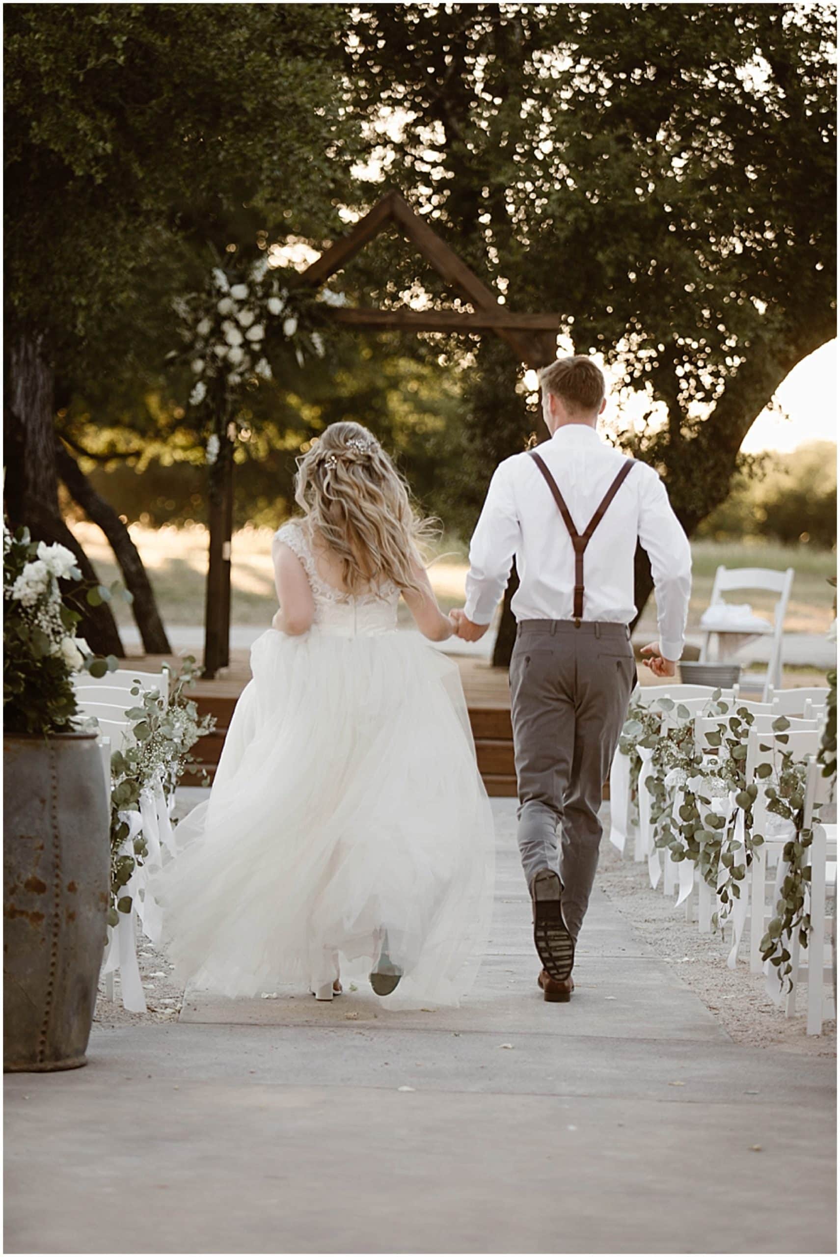 bride and groom running down aisle, Brit Nicole Photography, West Texas Barn Wedding, West Texas Small Wedding, West Texas wedding venue, DJ Platinum, Vera Wang engagement ring, Zales Manly Bands wedding ring, David's Bridal wedding dress, Krazy Cakes brides wedding cake, wedding cupcake, Betsey Johnson wedding high heels, Joy's Downtown Flowers wedding decor, Sparrow Creek Ranch, texas wedding ranch, places to get married in Texas, small intimate wedding, summer wedding, texas sky, bride and groom first look, first look with dad, matching bridesmaids robes, June wedding, junebug weddings, wandering weddings, the knot, best weddings
