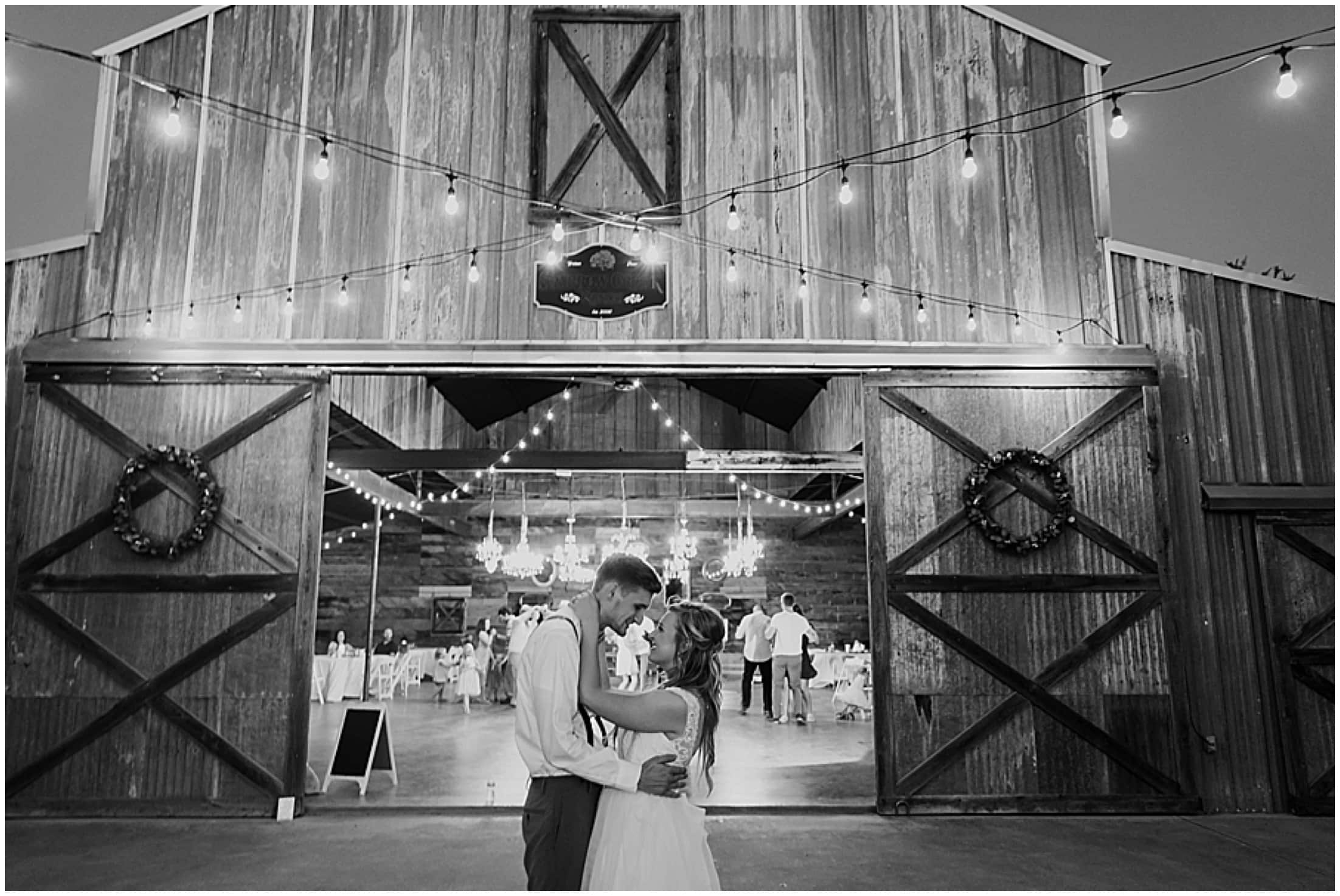 bride and groom kiss in front of the venue barn, Brit Nicole Photography, West Texas Barn Wedding, West Texas Small Wedding, West Texas wedding venue, DJ Platinum, Vera Wang engagement ring, Zales Manly Bands wedding ring, David's Bridal wedding dress, Krazy Cakes brides wedding cake, wedding cupcake, Betsey Johnson wedding high heels, Joy's Downtown Flowers wedding decor, Sparrow Creek Ranch, texas wedding ranch, places to get married in Texas, small intimate wedding, summer wedding, texas sky, bride and groom first look, first look with dad, matching bridesmaids robes, June wedding, junebug weddings, wandering weddings, the knot, best weddings