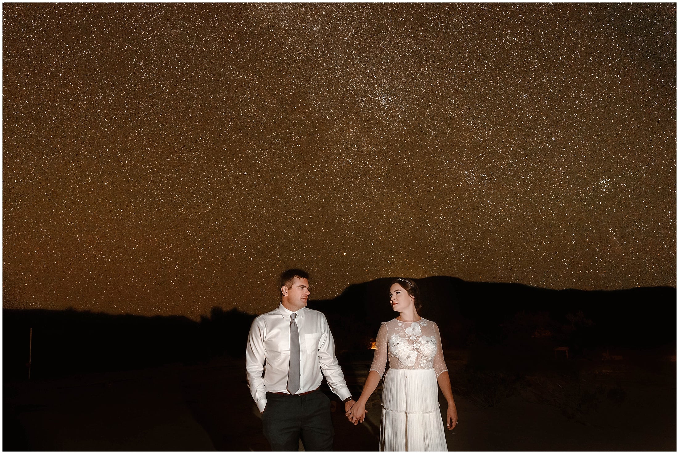 bride and groom under stars