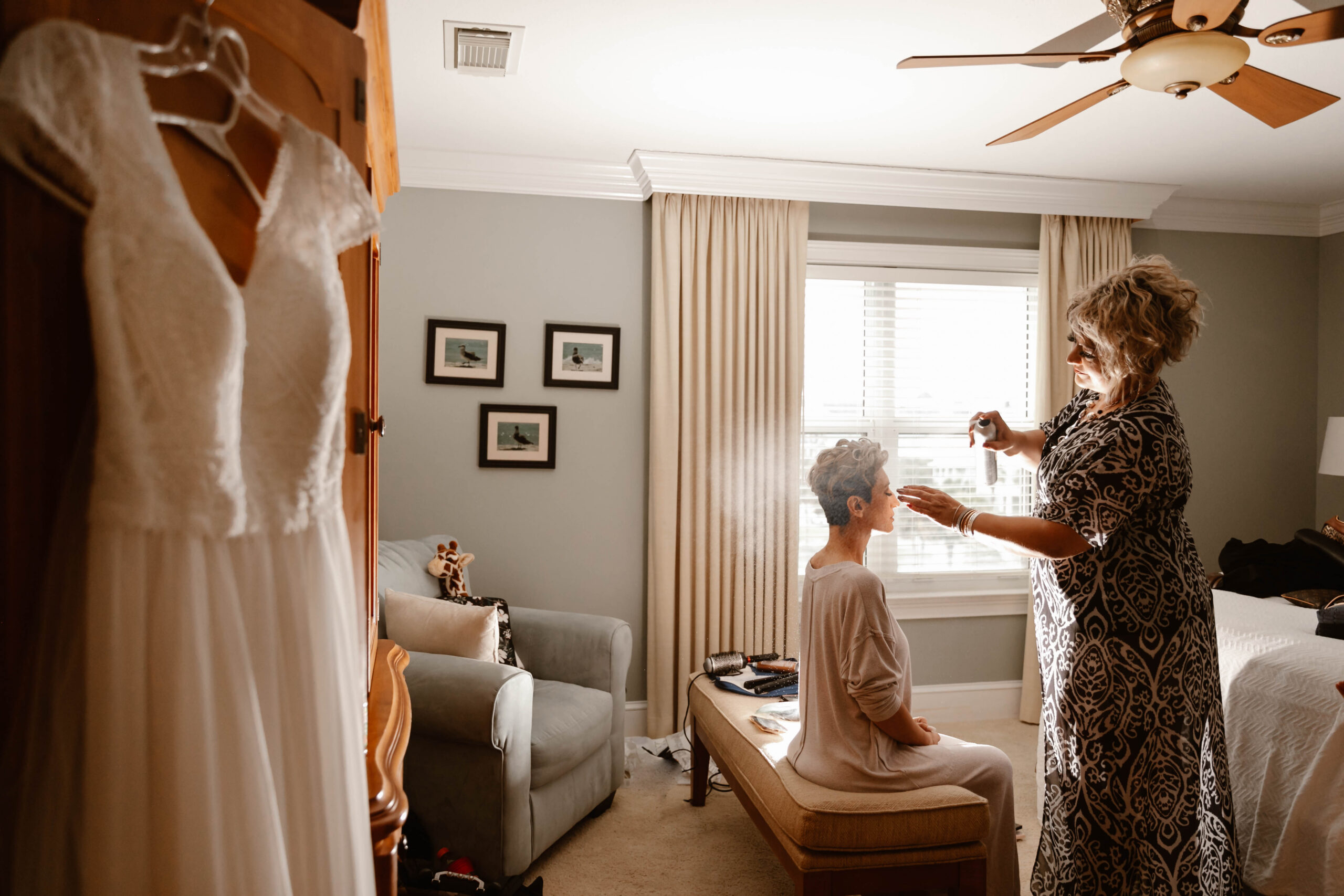 Bride getting ready in a Destin beach house before her vow renewal ceremony