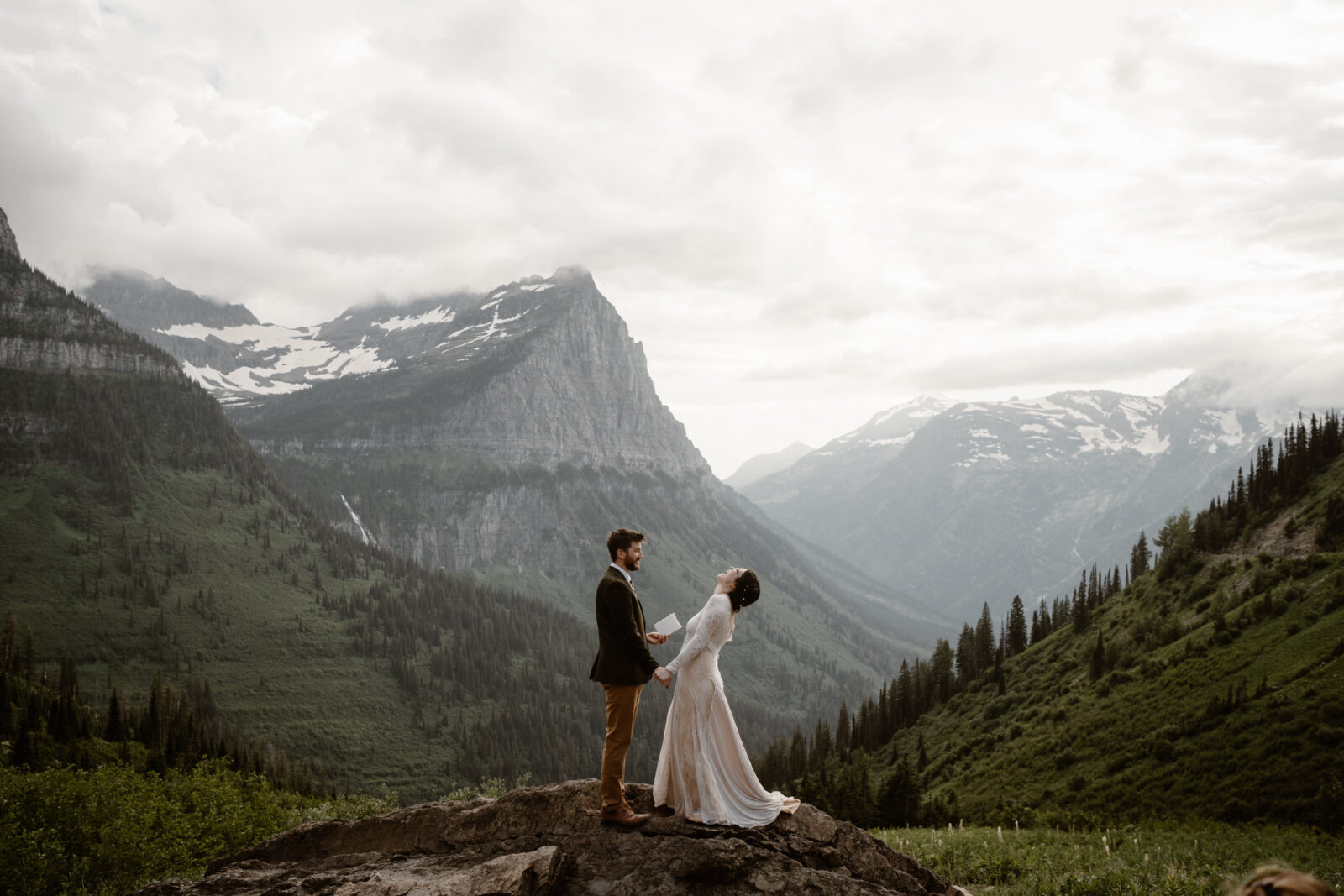 couple learning how to elope exchanging vows in the mountains of Glacier National Park Montana